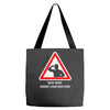 body under construction road sign Tote Bags