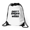 don't smoke shit weed Drawstring Bags