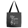 she wants the d black Tote Bags