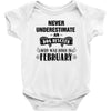 never underestimate an old man who was born in february Baby Onesie