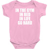 in the gym in bed in life go hard Baby Onesie