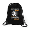 the best grandpas go running Drawstring Bags
