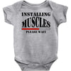 installing muscles Baby Onesie