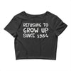 refusing to grow up since 1984 Crop Top
