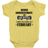 never underestimate an old man who was born in february Baby Onesie