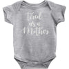 tired as a mother Baby Onesie