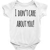 i don'tcare about you Baby Bodysuit