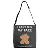 i can't feel my face Adjustable Strap Totes
