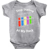 stop staring at my rack Baby Onesie