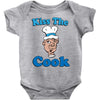 kiss the cook Baby Onesie