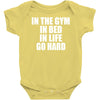 in the gym in bed in life go hard Baby Onesie