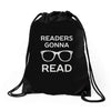reading pun humor Drawstring Bags