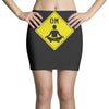 om sign Mini Skirts
