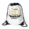 I Wear Gold For My Hero In Haven Drawstring Bags
