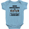 never underestimate an old man who was born in january Baby Onesie