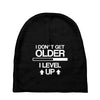i don't get older, i level up Baby Beanies