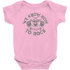 we know how to rock Baby Onesie