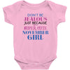 don't be jealous just because i'm a super cute november girl Baby Bodysuit