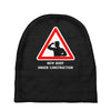 body under construction road sign Baby Beanies