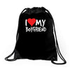 i love my boyfriend Drawstring Bags
