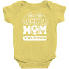 paid in hugs Baby Onesie