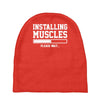 installing muscles funny Baby Beanies