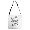 i don't care Adjustable Strap Totes