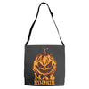 mad halloween pumpkin Adjustable Strap Totes