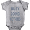 busy doing nothing girls Baby Onesie