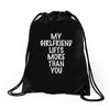 my girlfriend lifts more than you Drawstring Bags
