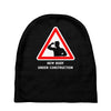 body under construction road sign Baby Beanies