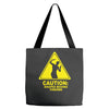 caution shapes being thrown printed Tote Bags