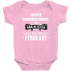 never underestimate an old man who was born in february Baby Onesie