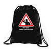 body under construction road sign Drawstring Bags