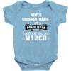 never underestimate an old man who was born in march Baby Onesie