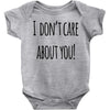 i don'tcare about you Baby Bodysuit
