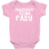 mommin' ain't easy Baby Onesie