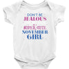 don't be jealous just because i'm a super cute november girl Baby Bodysuit
