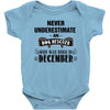 never underestimate an old man who was born in december Baby Onesie