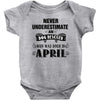 never underestimate an old man who was born in april Baby Onesie