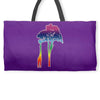 giraffe reaching up with its long neck to eat leaves off branches from Weekender Totes