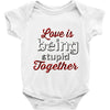 love is being stupid together Baby Onesie
