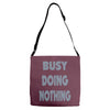 busy doing nothing girls Adjustable Strap Totes