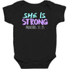 she is strong Baby Bodysuit