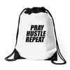 pray hustle repeat Drawstring Bags