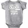 i don't get older, i level up Baby Onesie