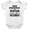 never underestimate an old man who was born in december Baby Onesie