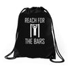 reach for the bars Drawstring Bags