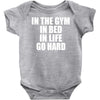 in the gym in bed in life go hard Baby Onesie