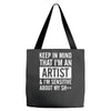 keep in mind that im an artist Tote Bags